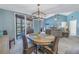 Bright dining room with a wooden table and wicker chairs near the living room at 6101 34Th W St # 19H, Bradenton, FL 34210