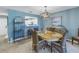Coastal-themed dining room features a light wood table and wicker chairs at 6101 34Th W St # 19H, Bradenton, FL 34210