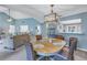 Dining room with four wicker chairs and a wood table, offering a great space for dining at 6101 34Th W St # 19H, Bradenton, FL 34210