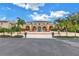 Spanish-style building with fountain, lush landscaping, and palm trees at 6101 34Th W St # 19H, Bradenton, FL 34210