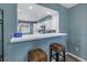 Kitchen breakfast bar with two wicker stools, offering a casual dining option at 6101 34Th W St # 19H, Bradenton, FL 34210