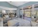 Bright living room with comfy seating, access to a screened patio, and dining area at 6101 34Th W St # 19H, Bradenton, FL 34210