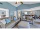 Living room with sofas and a striped ottoman, offering a relaxing atmosphere at 6101 34Th W St # 19H, Bradenton, FL 34210