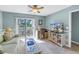 Bright living room with comfy sofa, workspace, and access to a private balcony at 6101 34Th W St # 19H, Bradenton, FL 34210