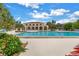 Inviting community pool with surrounding lounge chairs and building in background at 6101 34Th W St # 19H, Bradenton, FL 34210