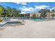 Refreshing community pool and spa with ample lounge chairs at 6101 34Th W St # 19H, Bradenton, FL 34210