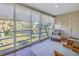 Relaxing sunroom with water views and wicker furniture at 6101 34Th W St # 19H, Bradenton, FL 34210