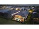 Stunning aerial view showcases the screened-in pool and landscaping of this desirable home with a lake view at 8328 Sea Glass Ct, Sarasota, FL 34240