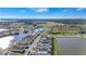 Beautiful aerial view of a luxurious community with lake, fountains, and lush landscaping at 8328 Sea Glass Ct, Sarasota, FL 34240