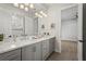 The bathroom features a double vanity, a well-lit shower, and a stylish design at 8328 Sea Glass Ct, Sarasota, FL 34240