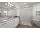 Elegant bathroom features a soaking tub and a glass-enclosed shower with marble-like tiles and white cabinets at 8328 Sea Glass Ct, Sarasota, FL 34240