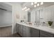 Bathroom with double vanity sinks, a large mirror, and a well lit shower stall at 8328 Sea Glass Ct, Sarasota, FL 34240
