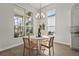 Breakfast nook featuring views of the lanai and outdoor grill and cooking area at 8328 Sea Glass Ct, Sarasota, FL 34240