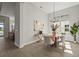 Formal dining room with natural light and modern decor at 8328 Sea Glass Ct, Sarasota, FL 34240