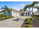 Beautiful single-Gathering home with a paved driveway, well-manicured landscaping, and a two-car garage at 8328 Sea Glass Ct, Sarasota, FL 34240