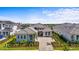 Striking front exterior showcasing meticulous landscaping, paved driveway, and a welcoming entrance at 8328 Sea Glass Ct, Sarasota, FL 34240