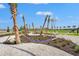 Relaxing hammock park surrounded by palm trees and manicured landscaping offers a serene outdoor escape at 8328 Sea Glass Ct, Sarasota, FL 34240