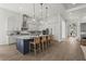 This spacious kitchen features a large island with seating and modern stainless steel appliances at 8328 Sea Glass Ct, Sarasota, FL 34240