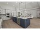 Spacious kitchen with island including dishwasher, sink, and seating for entertaining guests at 8328 Sea Glass Ct, Sarasota, FL 34240