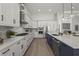 Modern kitchen featuring stainless steel appliances, gas range and a large center island at 8328 Sea Glass Ct, Sarasota, FL 34240