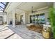 Covered lanai with stylish furniture, summer kitchen, and beautiful views of the lake at 8328 Sea Glass Ct, Sarasota, FL 34240