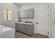 Laundry room featuring gray cabinets, light countertop, washer, dryer, sink, and window at 8328 Sea Glass Ct, Sarasota, FL 34240