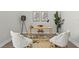 Stylish office with comfortable seating, a modern desk setup, and a neutral color scheme, perfect for productivity at 8328 Sea Glass Ct, Sarasota, FL 34240