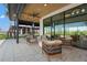 Inviting outdoor seating area with stylish furniture and views of lush green landscape and lake at 8328 Sea Glass Ct, Sarasota, FL 34240