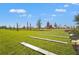 Lush playground with modern equipment, green spaces and seating create a fun, safe environment for children at 8328 Sea Glass Ct, Sarasota, FL 34240