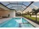 Stunning view of the pool and sun shelf and the beautiful lake, palms and sunset at 8328 Sea Glass Ct, Sarasota, FL 34240
