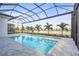 Screened-in pool with a sun shelf and lovely views of the lake and surrounding landscape at 8328 Sea Glass Ct, Sarasota, FL 34240