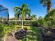 Landscaped backyard with lush greenery and privacy at 8752 Bellussi Dr, Sarasota, FL 34238