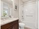 Clean bathroom with granite countertop, tub, and shower at 8752 Bellussi Dr, Sarasota, FL 34238