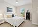 Bright bedroom featuring a comfortable queen-size bed and ample natural light at 8752 Bellussi Dr, Sarasota, FL 34238
