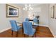 Bright dining room with hardwood floors and a glass table at 8752 Bellussi Dr, Sarasota, FL 34238