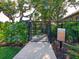 Fenced-in dog park with a paved pathway and rules signage at 8752 Bellussi Dr, Sarasota, FL 34238