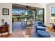 Gathering room with sliding doors leading to a screened patio at 8752 Bellussi Dr, Sarasota, FL 34238