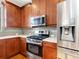 Modern kitchen with stainless steel appliances and granite countertops at 8752 Bellussi Dr, Sarasota, FL 34238