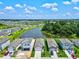 New homes surrounding a lake, under construction at 9016 Waxwing Way, Parrish, FL 34219