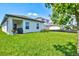 Spacious backyard with grassy lawn, providing ample outdoor space at 9016 Waxwing Way, Parrish, FL 34219