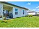 Private backyard with patio, grill, and grass at 9016 Waxwing Way, Parrish, FL 34219