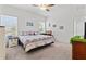 Spacious main bedroom with ceiling fan and large windows at 9016 Waxwing Way, Parrish, FL 34219