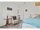 Bedroom with a queen-size bed and an adjacent sitting area at 9016 Waxwing Way, Parrish, FL 34219
