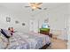 Comfortable main bedroom with ceiling fan, rocking chair, and dresser at 9016 Waxwing Way, Parrish, FL 34219