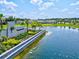 Community entrance with landscaping and a pond at 9016 Waxwing Way, Parrish, FL 34219