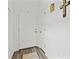 Bright entryway with white door, wood-look flooring, and neutral decor at 9016 Waxwing Way, Parrish, FL 34219