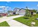 New construction home with a two-car garage and partial landscaping at 9016 Waxwing Way, Parrish, FL 34219