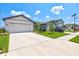 Two-story home with a two-car garage and landscaped yard at 9016 Waxwing Way, Parrish, FL 34219