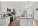 Bright kitchen featuring stainless steel appliances and an island at 9016 Waxwing Way, Parrish, FL 34219