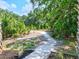Paved nature trail winding through lush greenery at 9016 Waxwing Way, Parrish, FL 34219